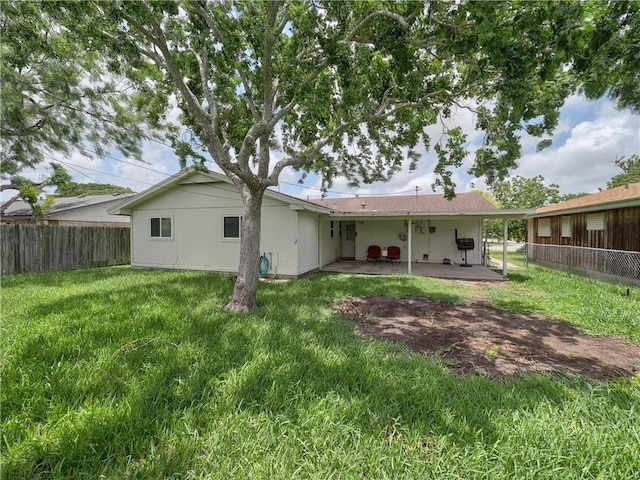 1638 Spicewood Dr, Corpus Christi, TX 78412 - rear view of house with a patio area and a fenced backyard