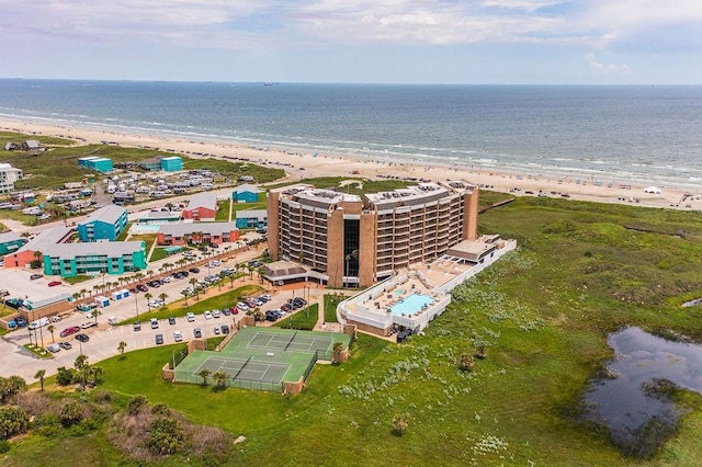 drone / aerial view featuring a view of the beach and a water view