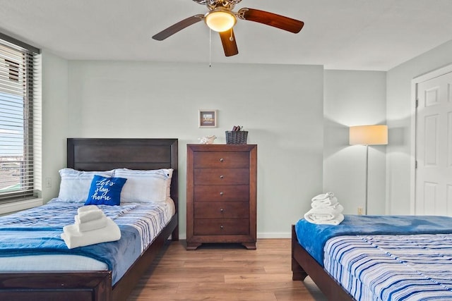 bedroom featuring hardwood / wood-style floors and ceiling fan