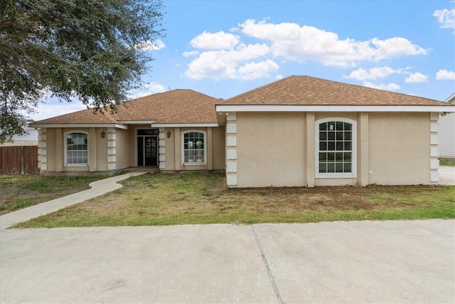 view of front of property with a front lawn