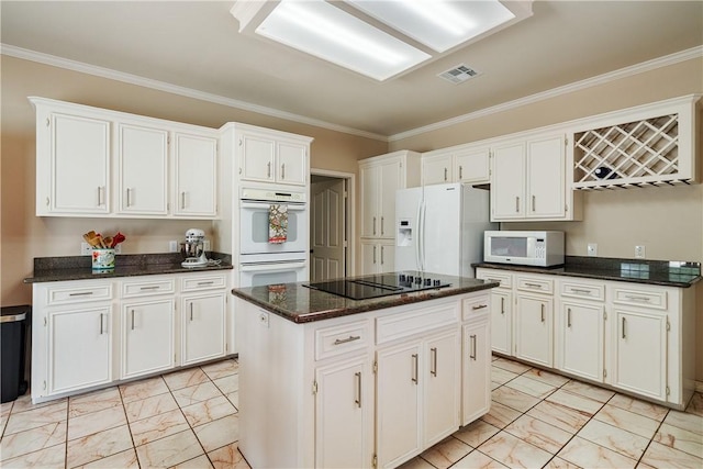 7526 Milan St, Corpus Christi, TX 78414 - kitchen with light marble finish flooring, white appliances, white cabinets, and ornamental molding
