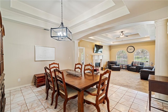 7526 Milan St, Corpus Christi, TX 78414 - dining room with decorative columns, a tray ceiling, a ceiling fan, light marble finish floors, and a glass covered fireplace