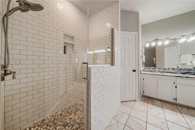 7526 Milan St, Corpus Christi, TX 78414 - bathroom with a stall shower, vanity, and marble look tile flooring