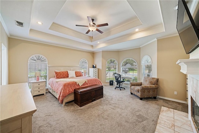 7526 Milan St, Corpus Christi, TX 78414 - bedroom featuring a tile fireplace, a raised ceiling, crown molding, light colored carpet, and recessed lighting