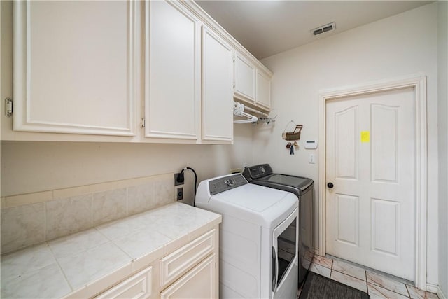 7526 Milan St, Corpus Christi, TX 78414 - laundry area featuring cabinet space and washing machine and dryer