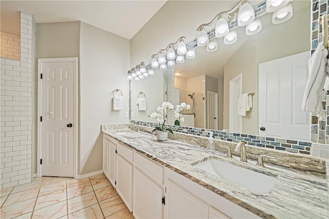 7526 Milan St, Corpus Christi, TX 78414 - full bath with double vanity, a tile shower, and marble finish flooring
