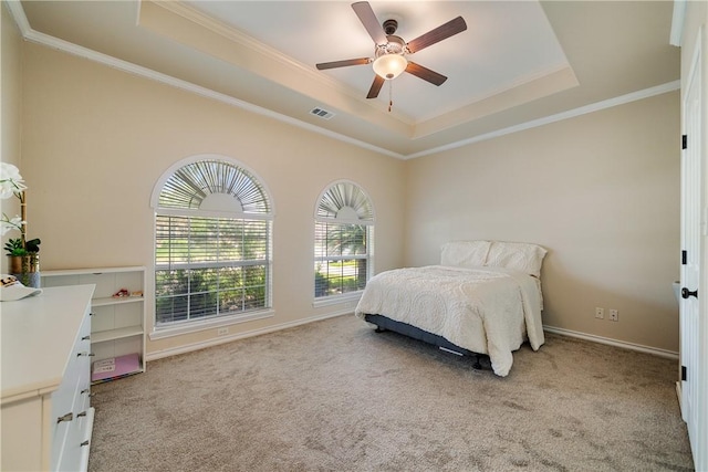7526 Milan St, Corpus Christi, TX 78414 - bedroom featuring a tray ceiling, crown molding, light colored carpet, and a ceiling fan