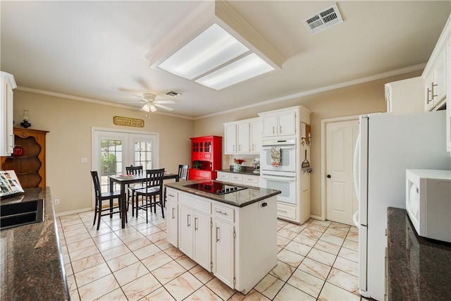 7526 Milan St, Corpus Christi, TX 78414 - kitchen with white appliances, light marble finish floors, a ceiling fan, ornamental molding, and white cabinets