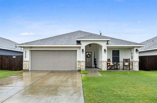 ranch-style house featuring a front yard, stone siding, and roof with shingles