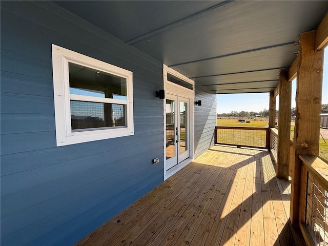 wooden deck featuring french doors