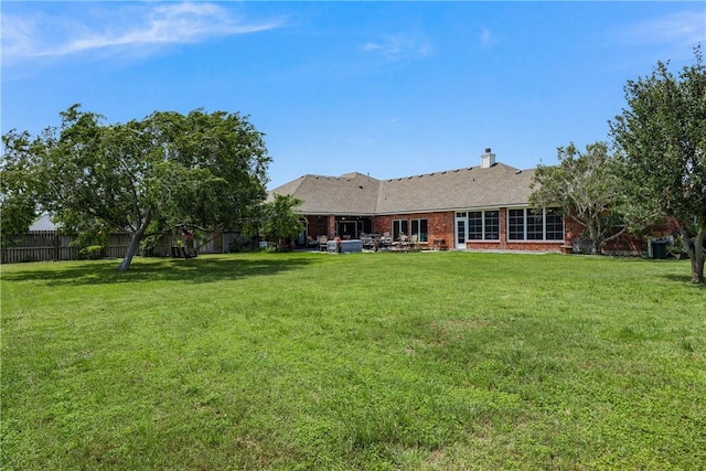 8102 Nazareth Dr, Corpus Christi, TX 78413 - back of house with brick siding, a chimney, and a patio area