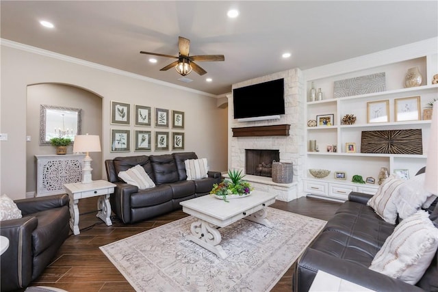 8102 Nazareth Dr, Corpus Christi, TX 78413 - living room with ceiling fan, ornamental molding, dark wood finished floors, recessed lighting, and a stone fireplace