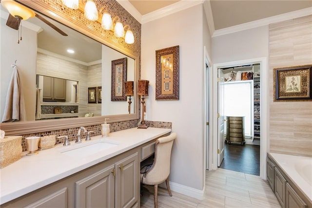 8102 Nazareth Dr, Corpus Christi, TX 78413 - bathroom featuring crown molding, decorative backsplash, vanity, baseboards, and a bath