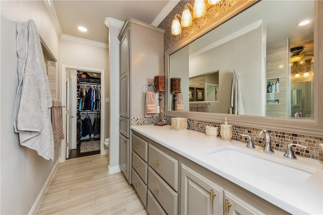 8102 Nazareth Dr, Corpus Christi, TX 78413 - full bathroom featuring tasteful backsplash, vanity, baseboards, crown molding, and toilet