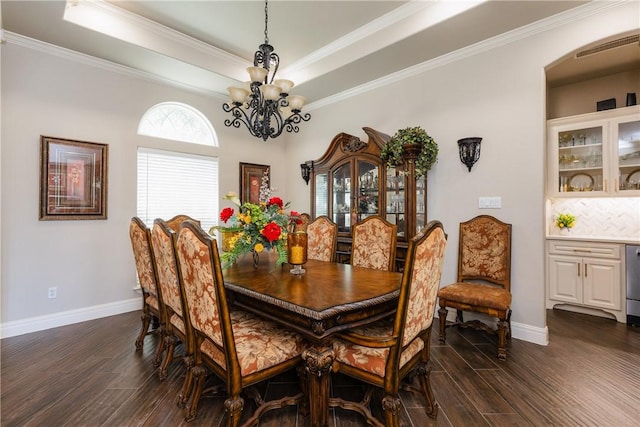 8102 Nazareth Dr, Corpus Christi, TX 78413 - dining space featuring a chandelier, dark wood-style flooring, baseboards, a raised ceiling, and ornamental molding