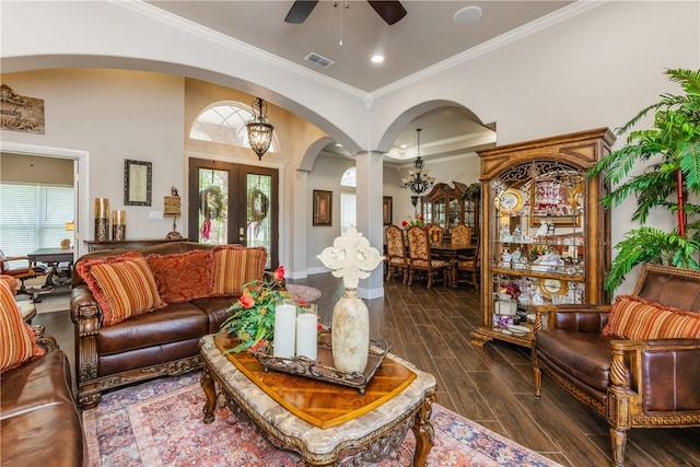 8102 Nazareth Dr, Corpus Christi, TX 78413 - living area featuring arched walkways, a ceiling fan, dark wood-style flooring, baseboards, and crown molding
