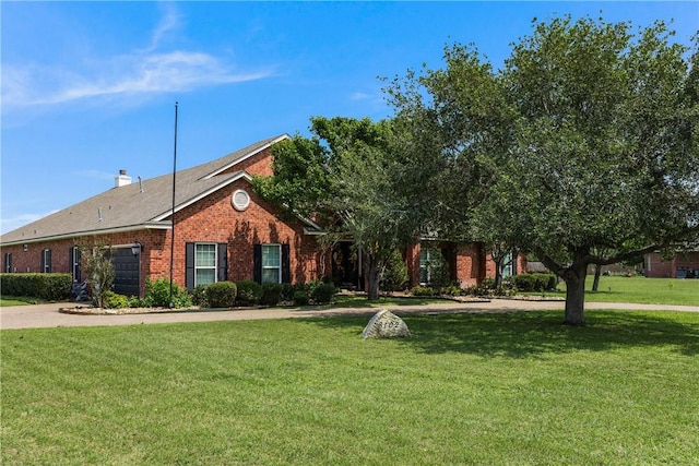 8102 Nazareth Dr, Corpus Christi, TX 78413 - view of front of property with brick siding, a front lawn, and a garage