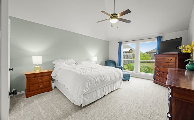 carpeted bedroom with ceiling fan and lofted ceiling