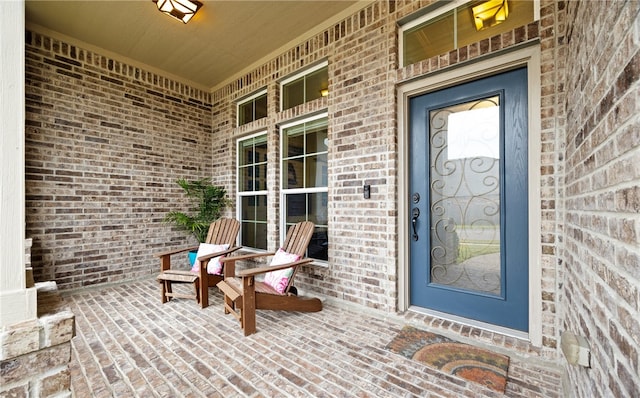 entrance to property featuring a porch