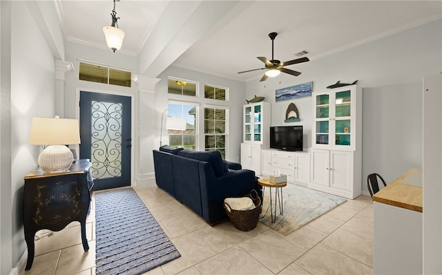 living room with ceiling fan, light tile patterned floors, and ornamental molding