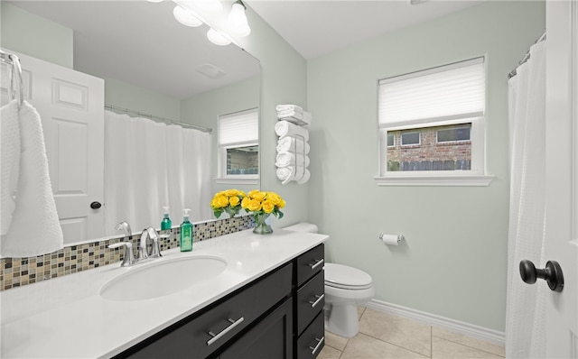 bathroom with tile patterned floors, vanity, and toilet