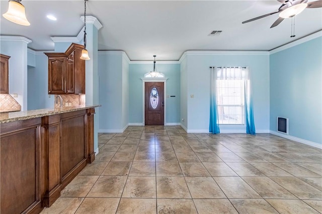 entrance foyer featuring a ceiling fan, visible vents, baseboards, and light tile patterned floors