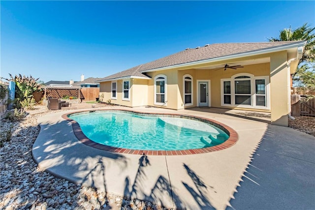 view of pool featuring ceiling fan, a patio, a fenced backyard, and a fenced in pool