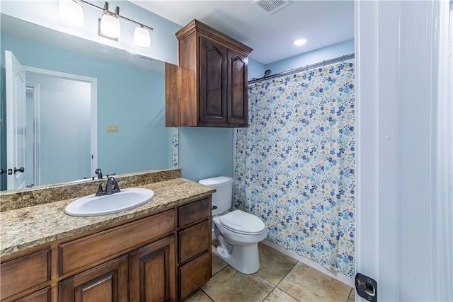 full bath featuring toilet, tile patterned flooring, vanity, and visible vents