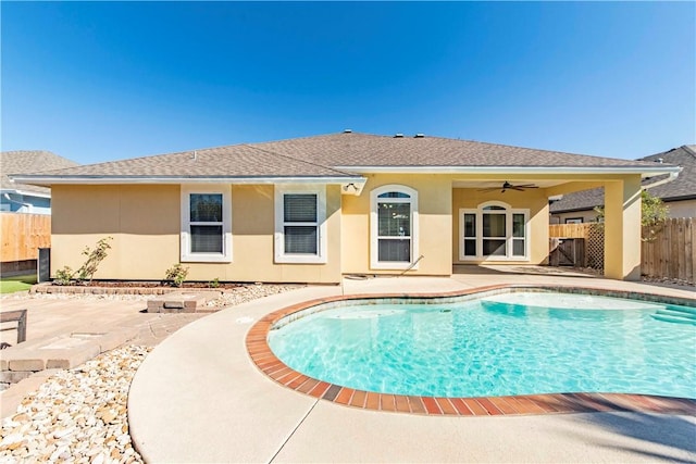 view of pool featuring a ceiling fan, a fenced in pool, fence, and a patio