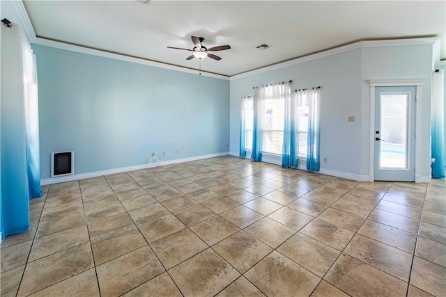 spare room with visible vents, crown molding, baseboards, and ceiling fan