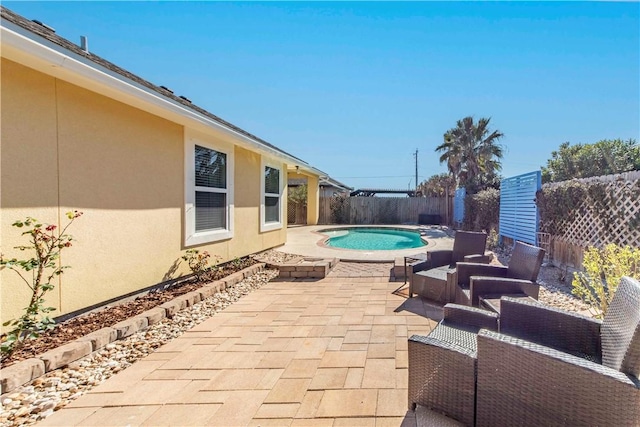 view of patio featuring a fenced in pool and a fenced backyard