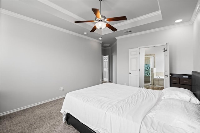 2101 Spoonbill Dr, Corpus Christi, TX 78414 - carpeted bedroom with ornamental molding, a raised ceiling, baseboards, recessed lighting, and ensuite bathroom