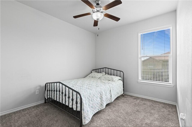 2101 Spoonbill Dr, Corpus Christi, TX 78414 - carpeted bedroom with baseboards and ceiling fan