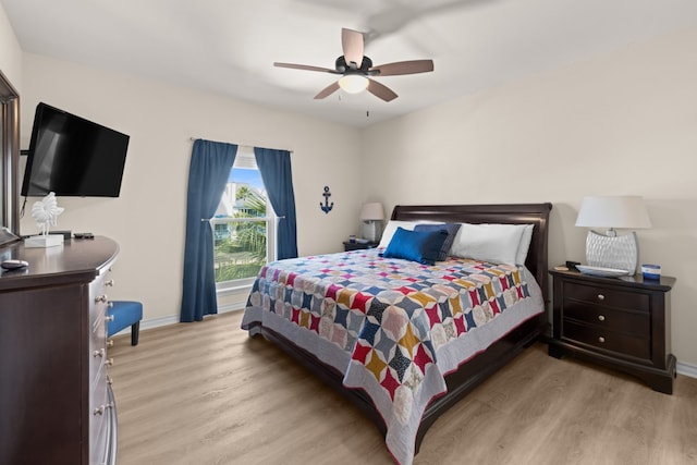 bedroom featuring ceiling fan and light hardwood / wood-style flooring