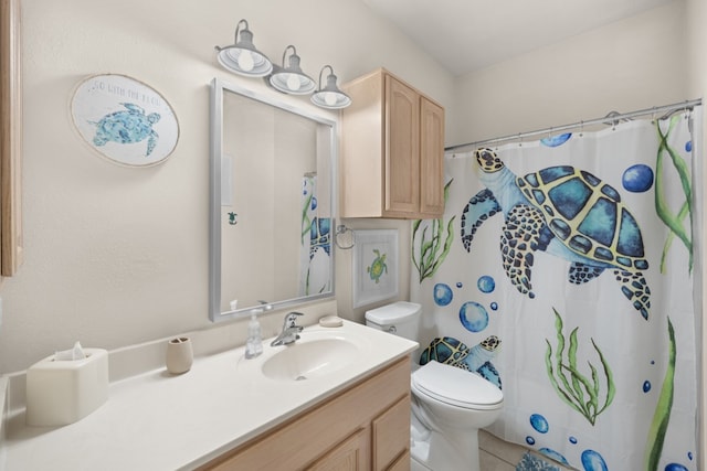 bathroom with vanity, tile patterned floors, toilet, and a shower with shower curtain