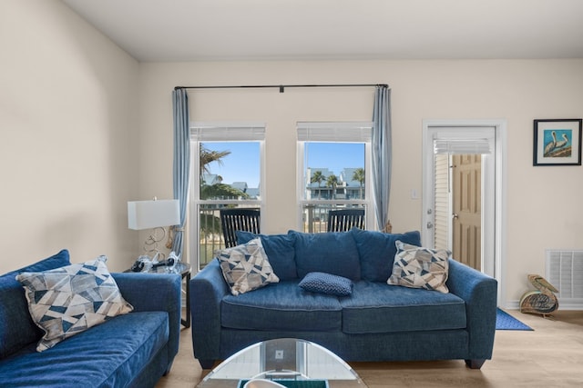 living room with light hardwood / wood-style flooring