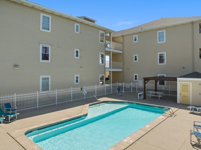 view of swimming pool with a patio