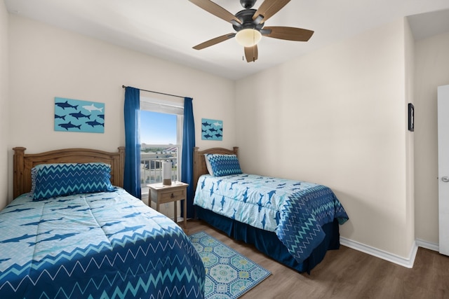 bedroom featuring wood-type flooring and ceiling fan