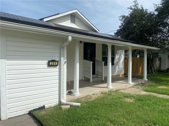 doorway to property featuring a yard