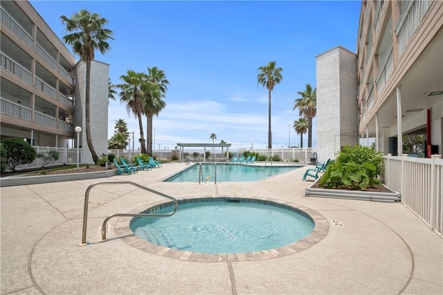 view of swimming pool with a patio area