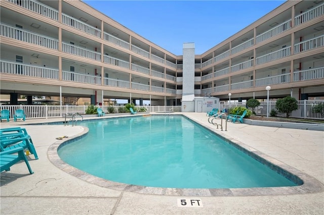 view of pool featuring a patio