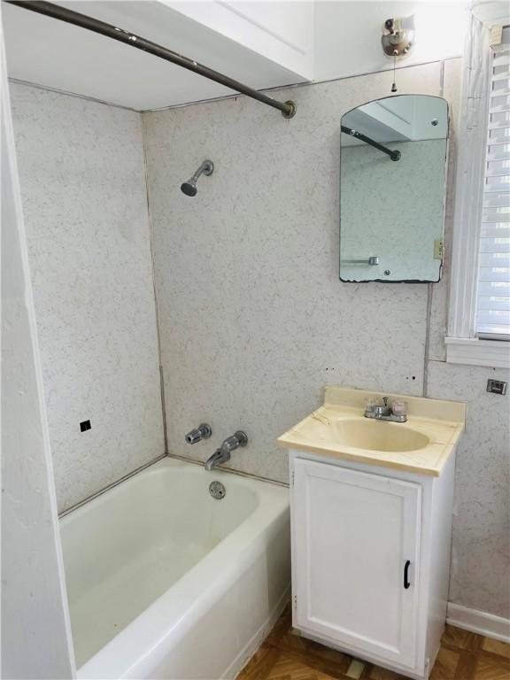 912 E Fulton St, Sinton, TX 78387 - bathroom featuring vanity and  shower combination