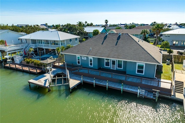 rear view of property featuring a water view