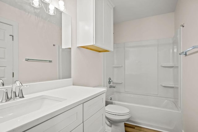 full bathroom featuring vanity, bathtub / shower combination, hardwood / wood-style floors, and toilet