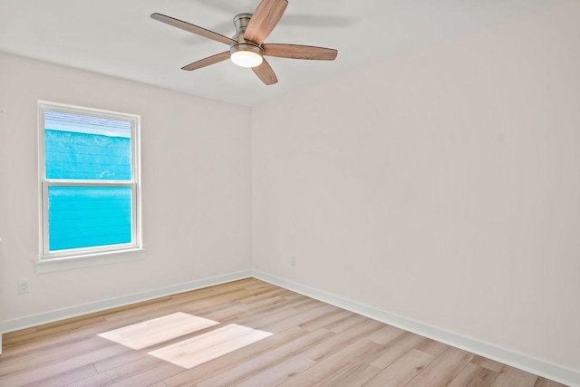 empty room featuring ceiling fan and light hardwood / wood-style floors