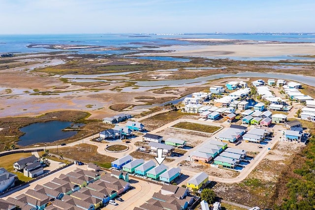 bird's eye view with a water view and a view of the beach