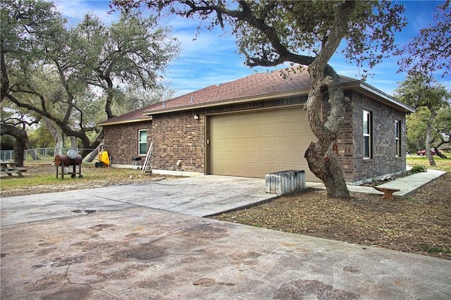 view of side of home with a garage