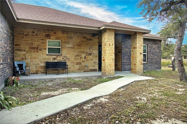 property entrance with a patio