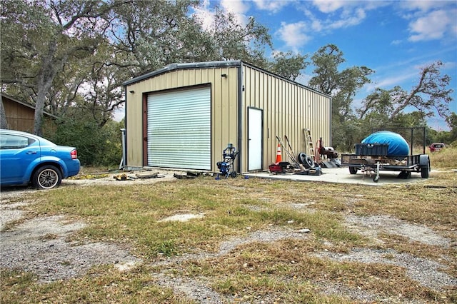 view of outbuilding featuring a garage