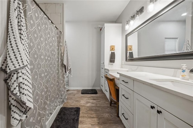 bathroom featuring hardwood / wood-style floors and vanity